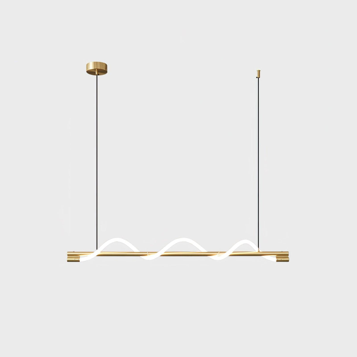 Brass Clérachic linear pendant with three small glowing waves and a round brass canopy, on a light backdrop.