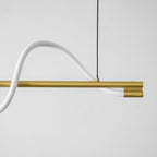 Close view of the white silicone line curving over the brass bar of this Clérachic linear pendant.