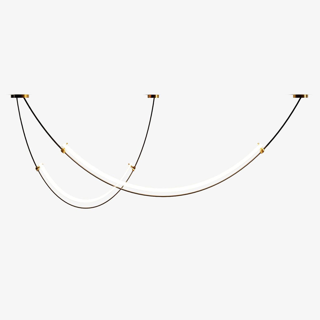 Two staggered LED bars on black cables from three gold-trimmed ceiling canopies, this Clérachic pendant shown lit on a plain white backdrop.