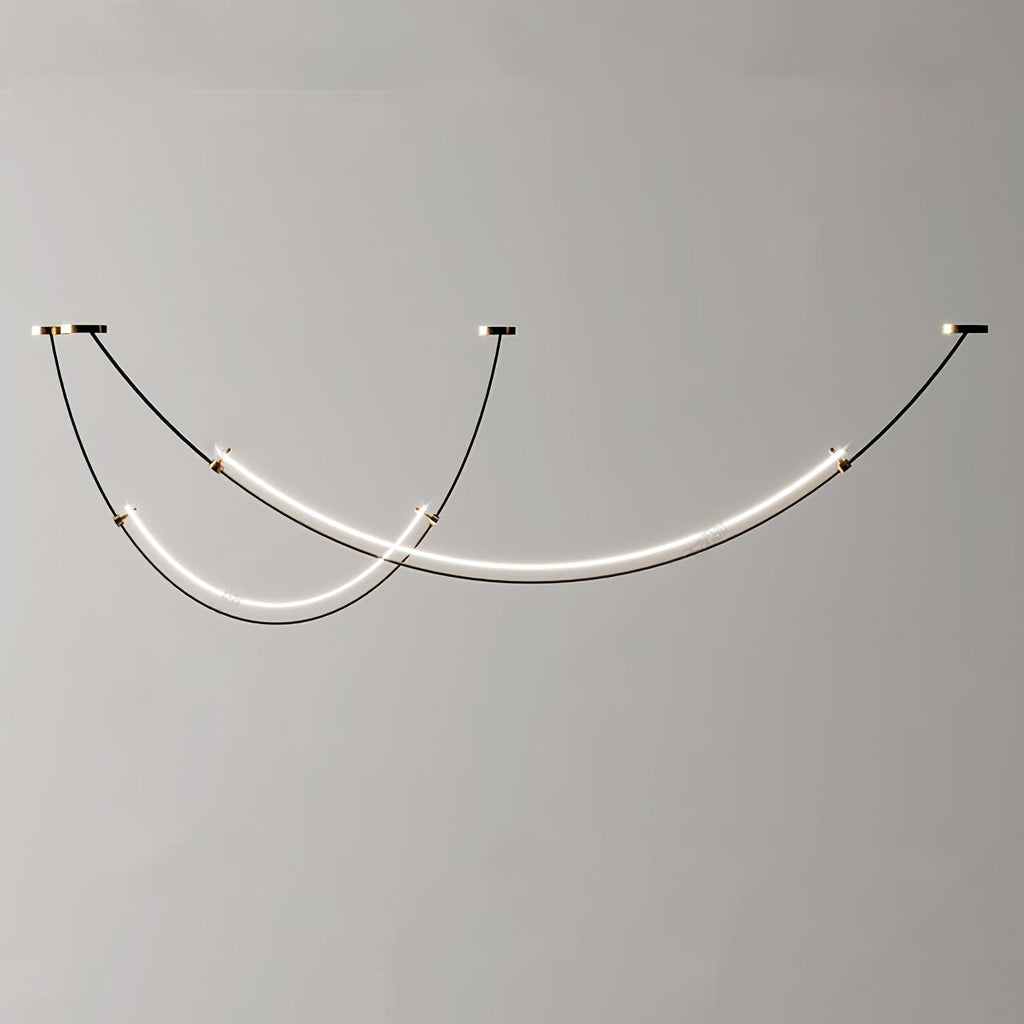 Unlit view of this Clérachic pendant against a plain grey wall, black cables running to three canopies with a gold trim.