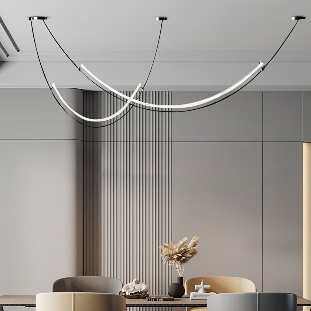 Close crop of this Clérachic pendant over a dining table with dried grasses in a black vase, beside a wall of vertical slats.