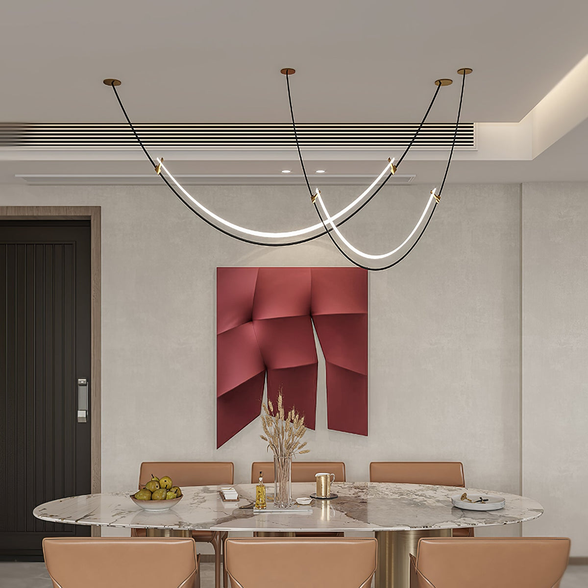 Clérachic pendant with gold canopies over a large oval marble table with tan chairs, a red sculptural panel on the wall behind.