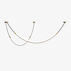 Clérachic pendant on a white backdrop, the long LED bar and the shorter one hung at different heights from thin black cables.
