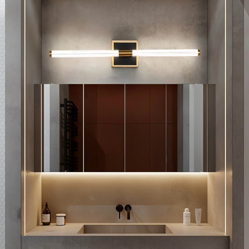 Clérachic LED tube wall light on a square plate above a mirrored bathroom cabinet and stone washbasin with a black tap.