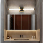 Clérachic LED tube wall light on a square plate above a mirrored bathroom cabinet and stone washbasin with a black tap.