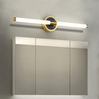 Clérachic LED tube wall light above a mirrored bathroom cabinet, on a round black plate with a brass rim.