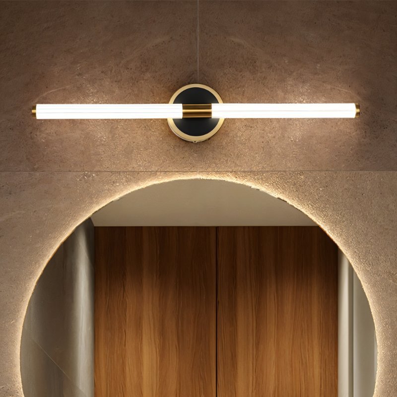 Clérachic LED tube wall light above a backlit arched mirror, on a round black plate with a thin brass rim.