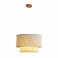 Full studio shot of this Clérachic pendant on its twisted wood-tone cord and round ceiling canopy.