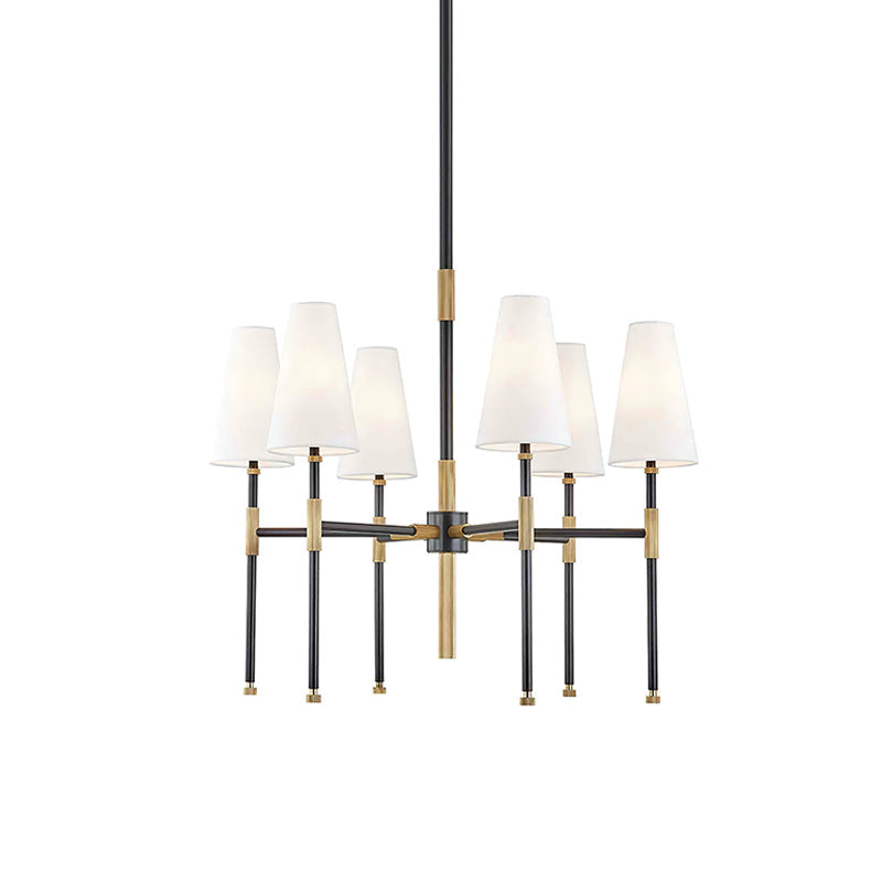 This Clérachic six-light chandelier in black and brass, shown on a plain white backdrop with the tapered linen shades facing up.