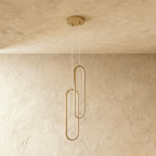 Clérachic double brushed gold oval loop pendant, two linked rings unlit, hung from a round gold canopy.