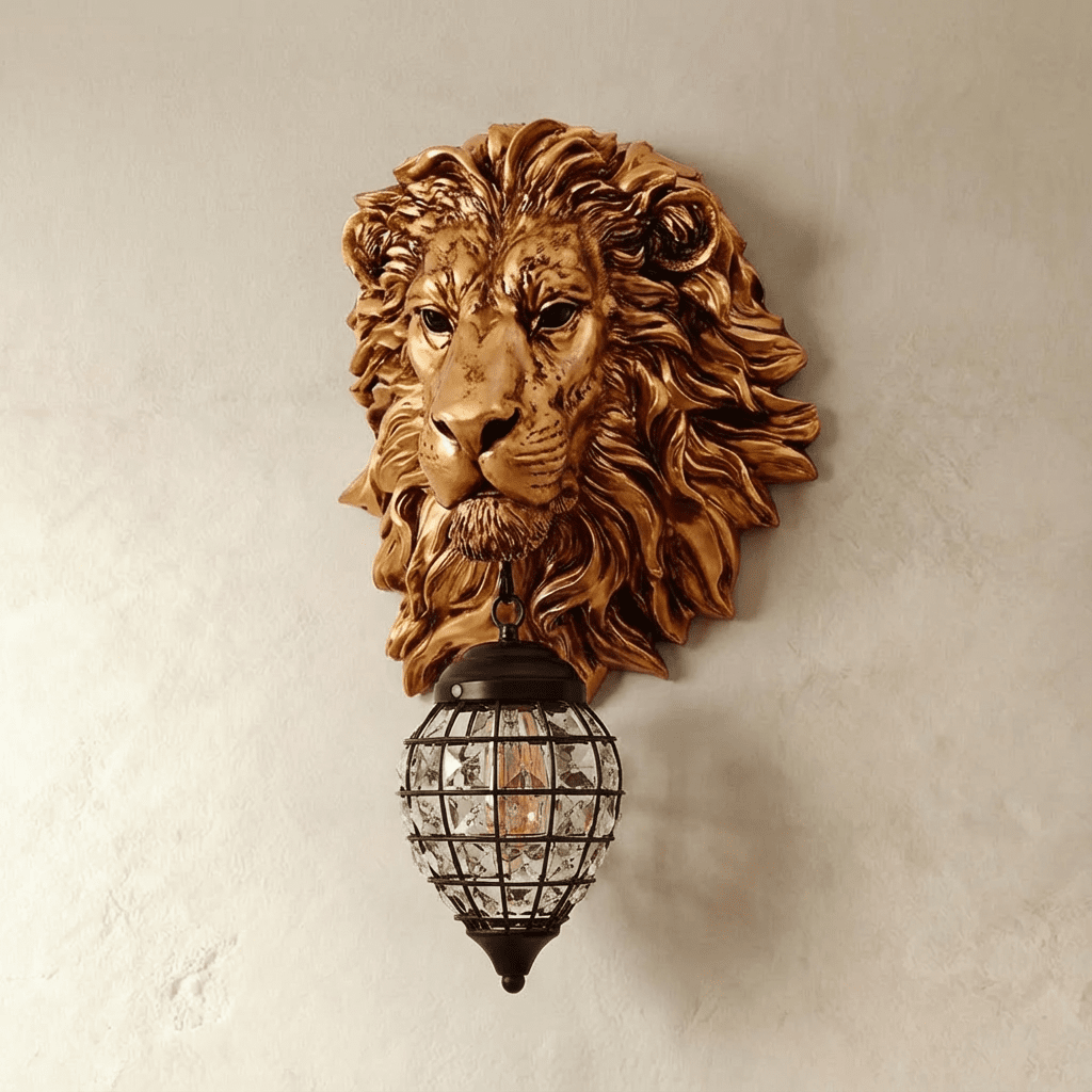 Clérachic wall light with a bronze-gold lion head and a caged crystal lantern, shown unlit with the bulb filament visible.