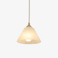 The Clérachic cone shown a touch closer, its stone shade glowing amber around the small opal bulb beneath.