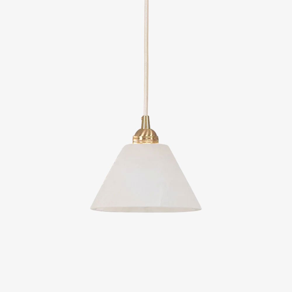 The Clérachic conical shade unlit on white, cool and chalky, hung from a slim brushed brass fitting.