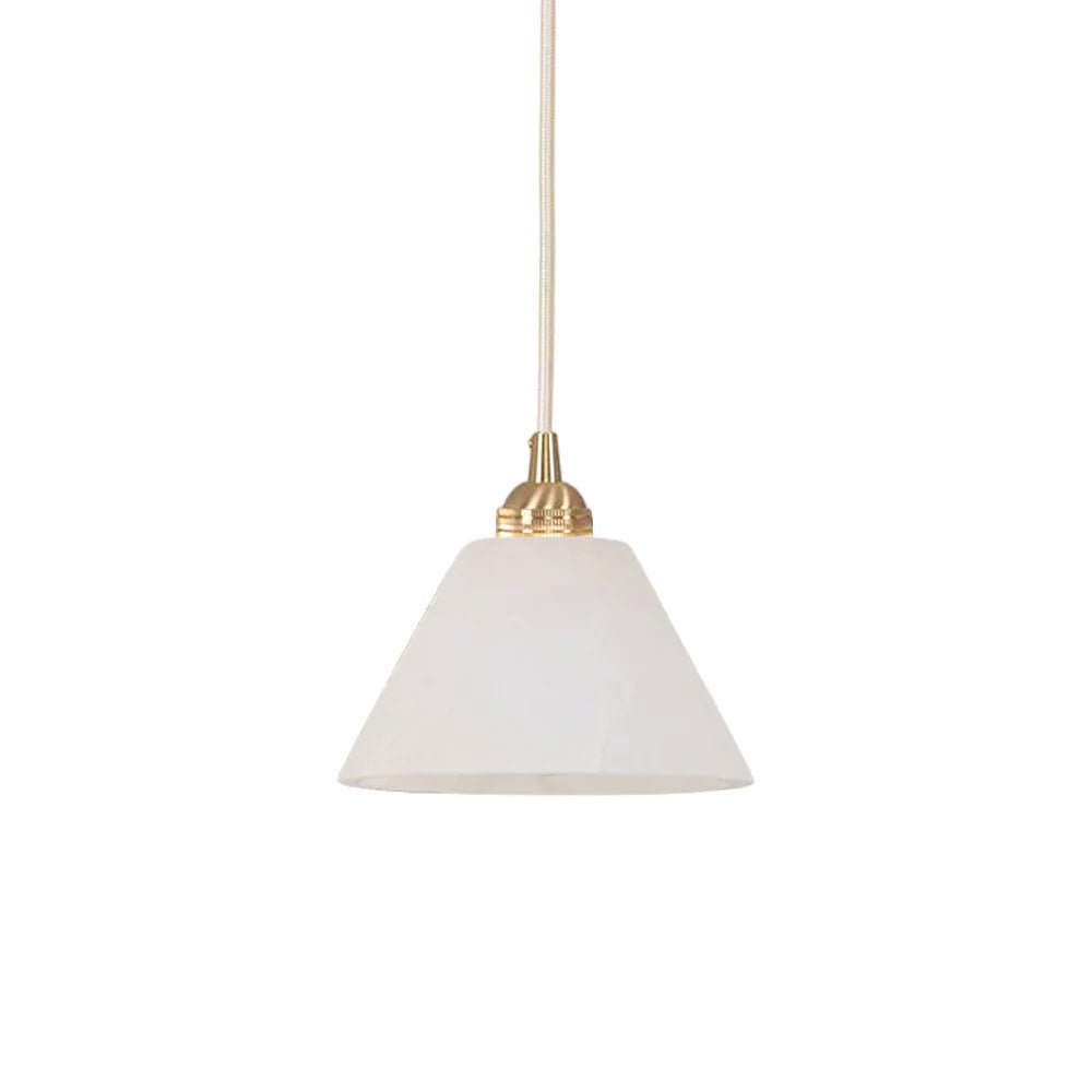 Clérachic pendant shown at full drop, cream braided flex running down to the brass collar and stone cone.