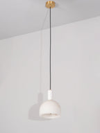 Full drop of the Clérachic Long-Drop Dome pendant light, brass ceiling canopy to shade down a long black cord.