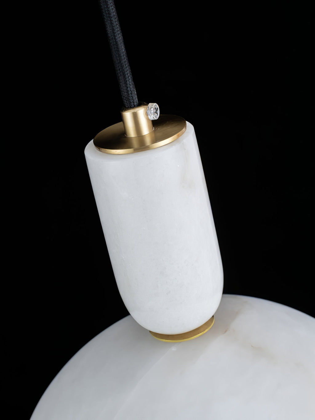 Detail of the Clérachic Long-Drop Dome pendant light stem, its brushed brass disc and small brass set screw.