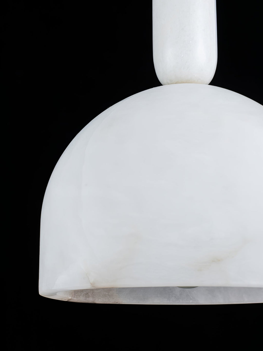 Extreme close-up of the Clérachic Long-Drop Dome pendant light shade, cloudy alabaster veining against black.
