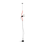 Clérachic pendant light with a red bendable cord section and a black spotlight head on a thin ceiling cable, on white.