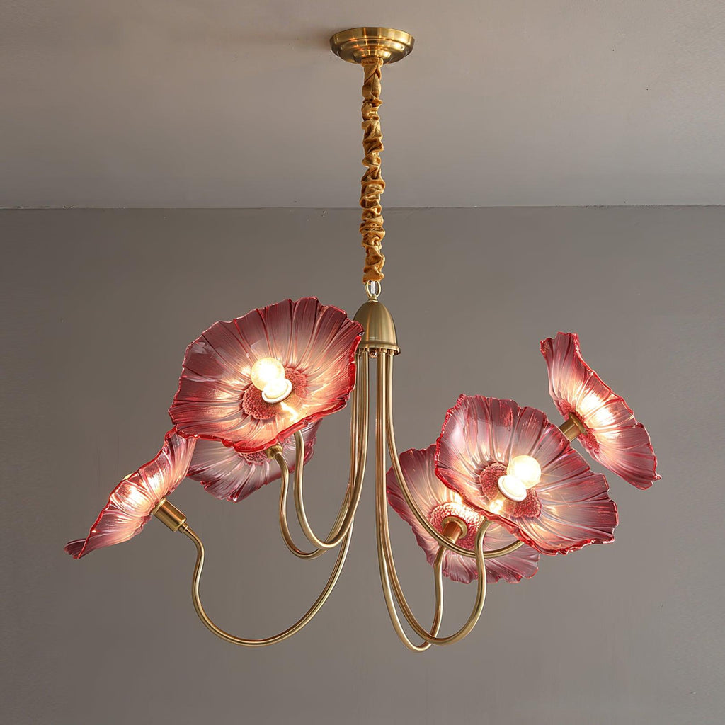 The 6-light pink glass Clérachic Lotus Blossom Chandelier, six blush shades lit against a grey wall.