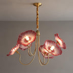 The 6-light pink glass Clérachic Lotus Blossom Chandelier, six blush shades lit against a grey wall.