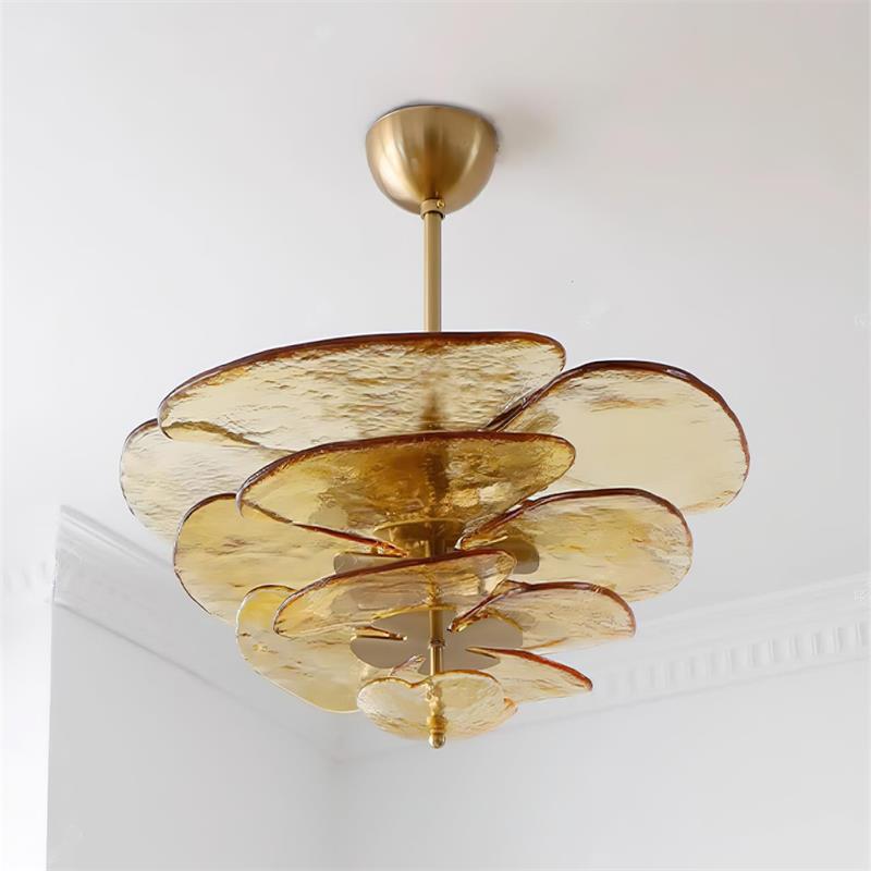 Amber Clérachic Lotus Leaf Glass Chandelier fitted close to a white ceiling beside cornice moulding, unlit.