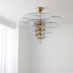 Clear Clérachic Lotus Leaf Glass Chandelier lit in a corner with white cornice moulding and daylight nearby.