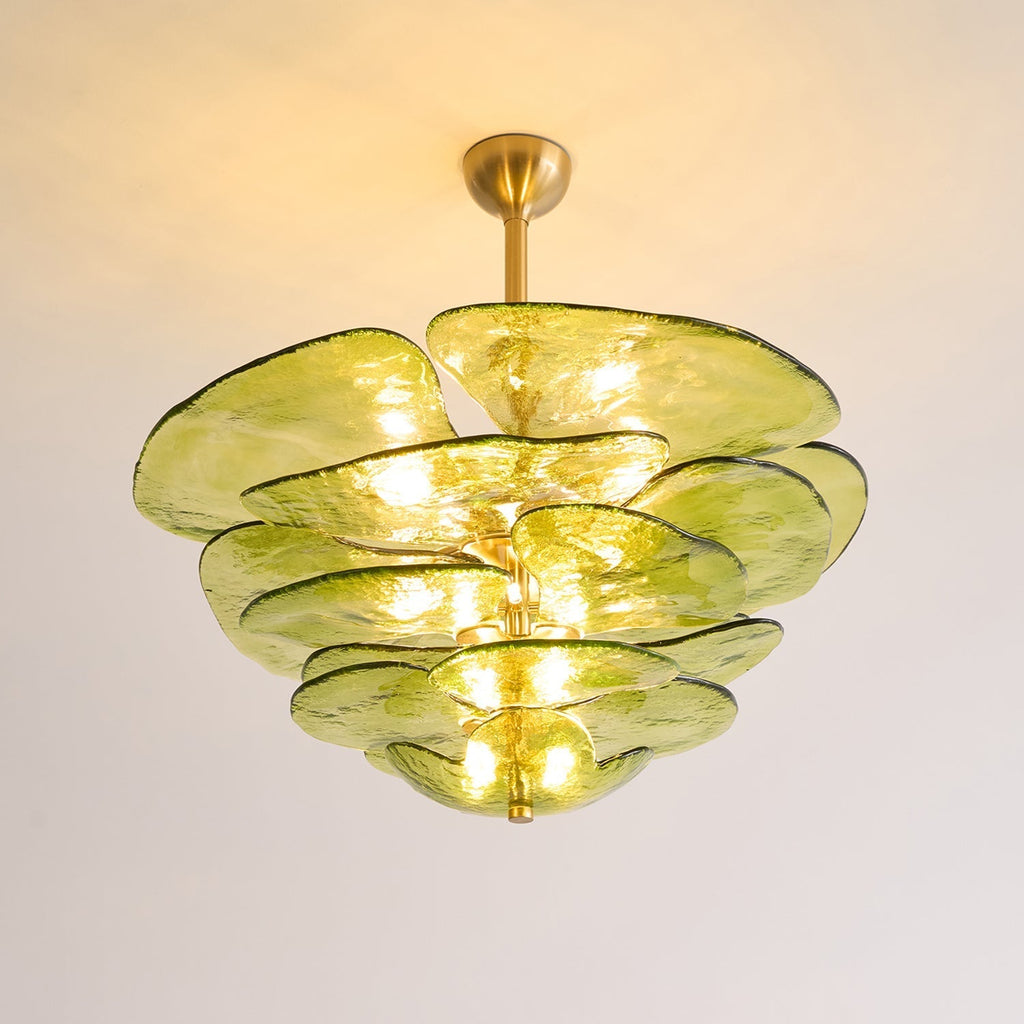 Green Clérachic lotus leaf chandelier lit against a warm-toned ceiling, hung on a short brass stem and canopy.