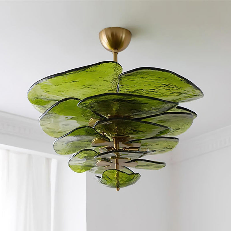 Green Clérachic Lotus Leaf Glass Chandelier fitted close to the ceiling, seen from below beside a white curtain.