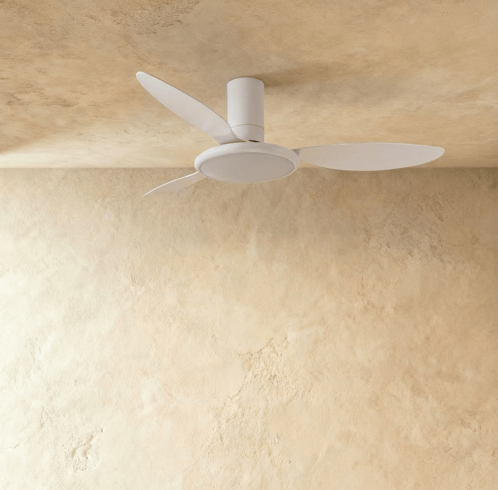 Clérachic matte white ceiling fan with a light switched off in studio, three slim blades around a flat round LED disc.