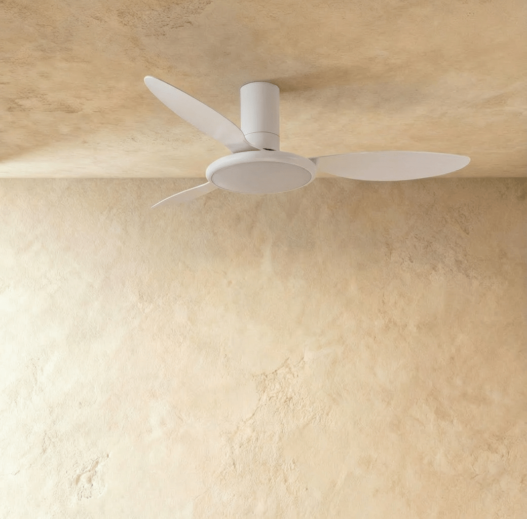 Clérachic matte white ceiling fan with a light switched off in studio, three slim blades around a flat round LED disc.