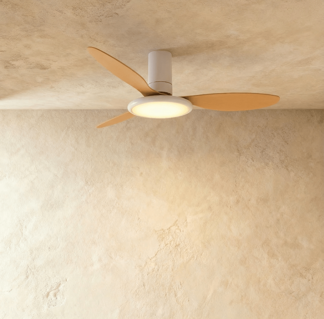 Clérachic ceiling fan with a light: a white body with wood-toned blades and a warm round LED disc, in studio.