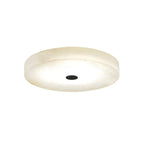 The black-cap finish of the Clérachic drum flush mount ceiling light, a pale alabaster disc with a matte black centre disc.