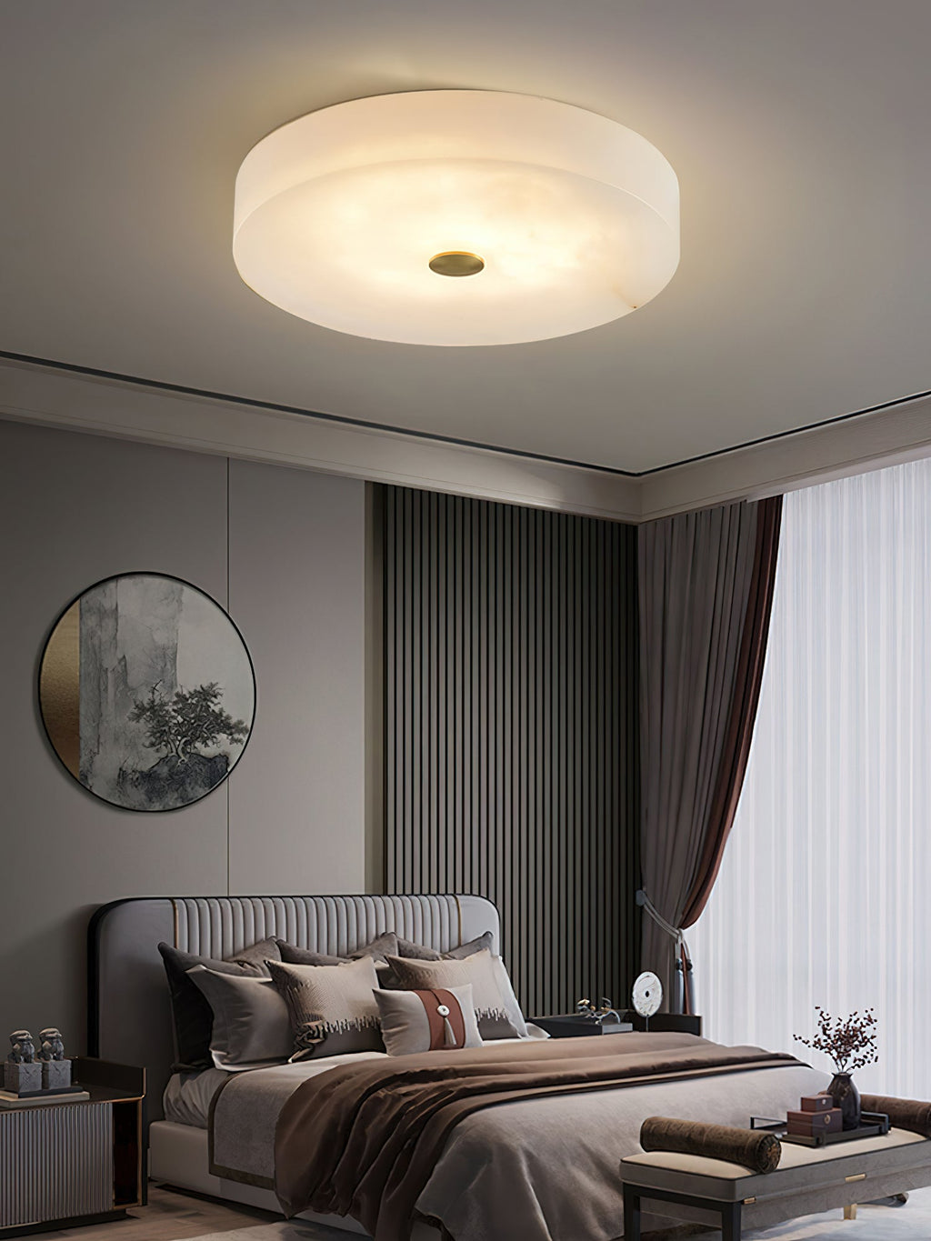 Clérachic drum ceiling light warming a bedroom with slatted panelling, the alabaster lit through to a soft honey tone.