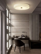 Clérachic flush mount ceiling light in a narrow study nook, lighting the desk and chair below from a flush ceiling fitting.