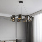 Large black-frame Clérachic chandelier with smoked glass shades hung in a room with grey panelled walls and heavy curtains.