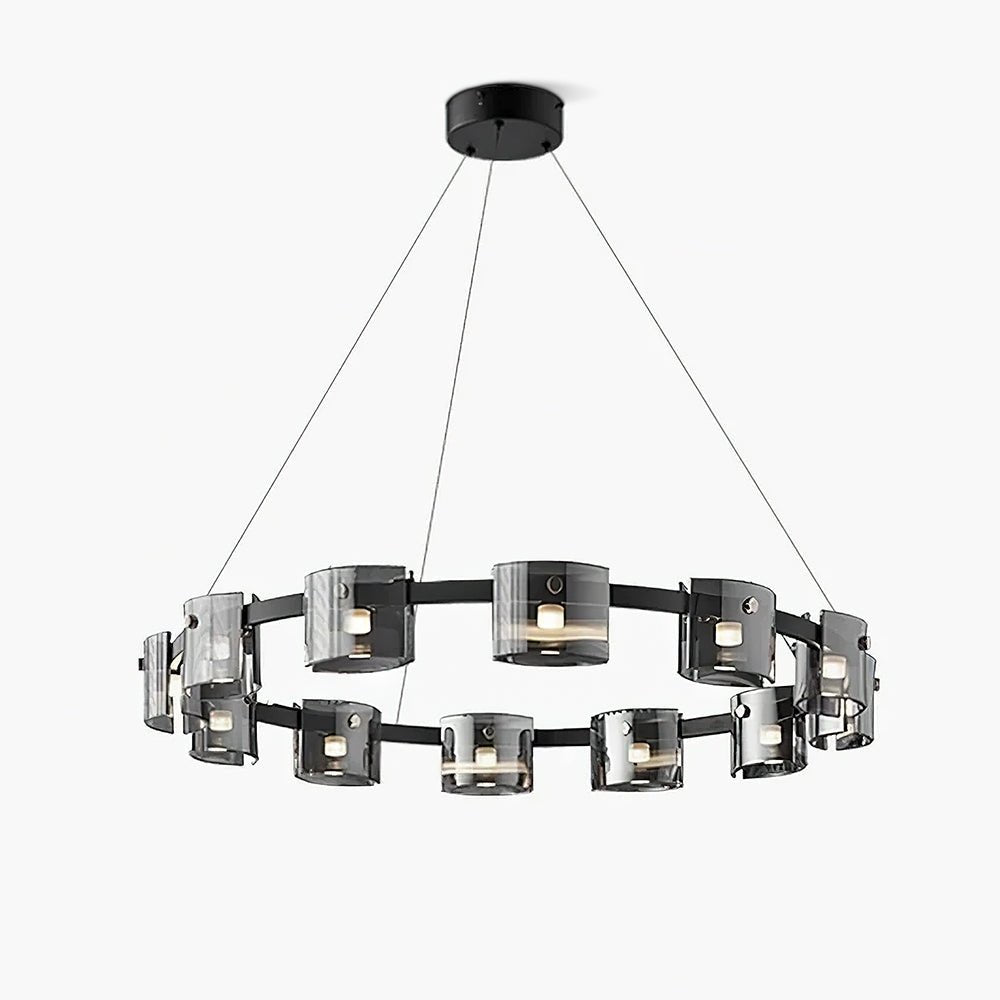 Wide black ring chandelier from Clérachic with smoked glass cylinders and three hanging cables, on a pale backdrop.