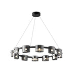 Black-frame ring chandelier from Clérachic shown from slightly below, with smoked glass shades around the band, on white.