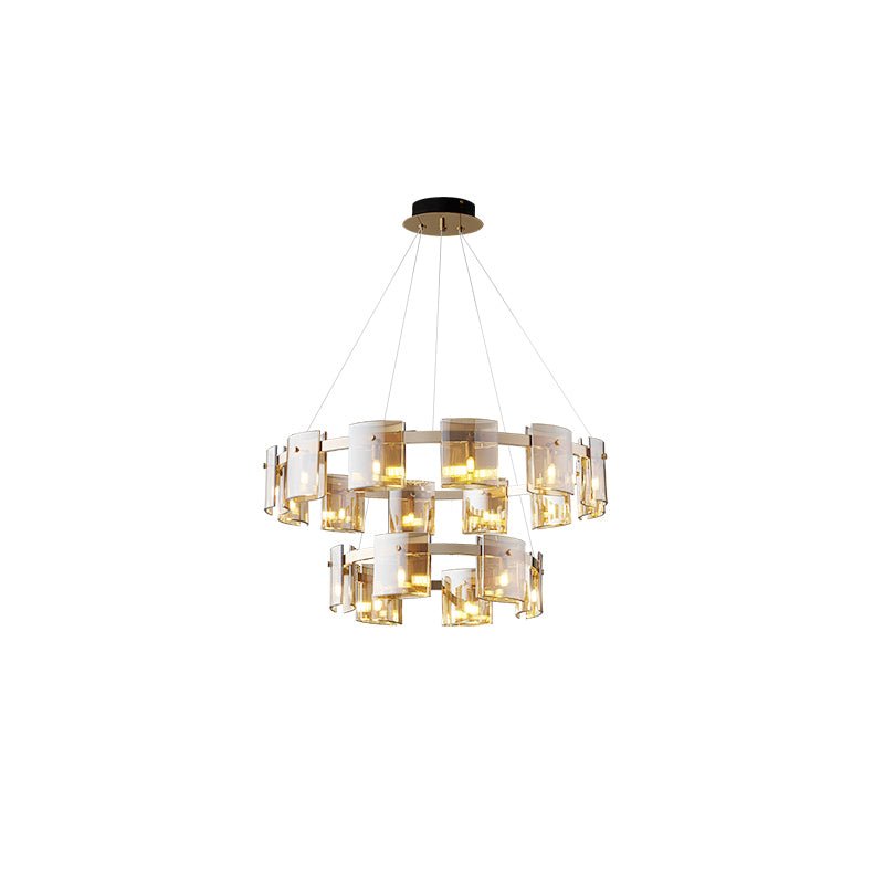 Two-tier gold-frame chandelier from Clérachic with amber glass shades on both rings and a gold canopy, on white.