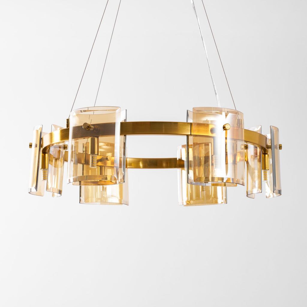 Gold-frame ring chandelier from Clérachic with amber glass shades and a brushed metal band, on a clean white background.