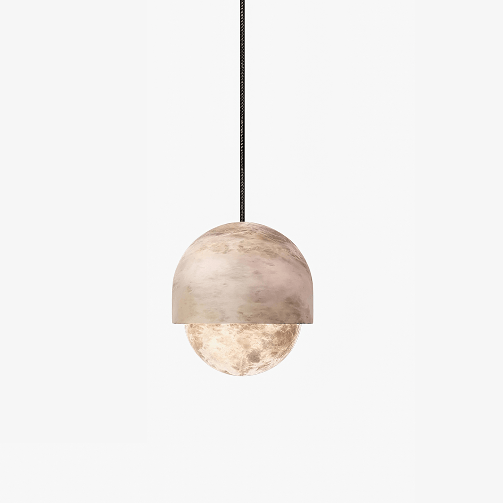 The Clérachic Lunar pendant in the mid size, stone cap sitting over the rounded diffuser.
