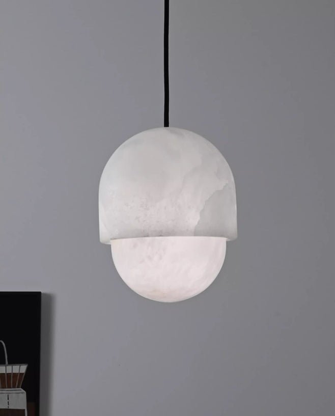 Clérachic Lunar pendant unlit on grey, matte alabaster reading soft white.