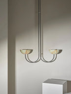 The Clérachic Lunaris pendant in nickel, twin stone bowls tipped up towards the ceiling.