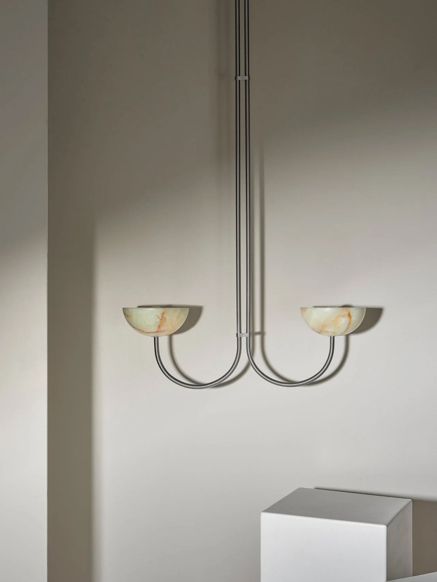 The Clérachic Lunaris pendant in nickel, twin stone bowls tipped up towards the ceiling.
