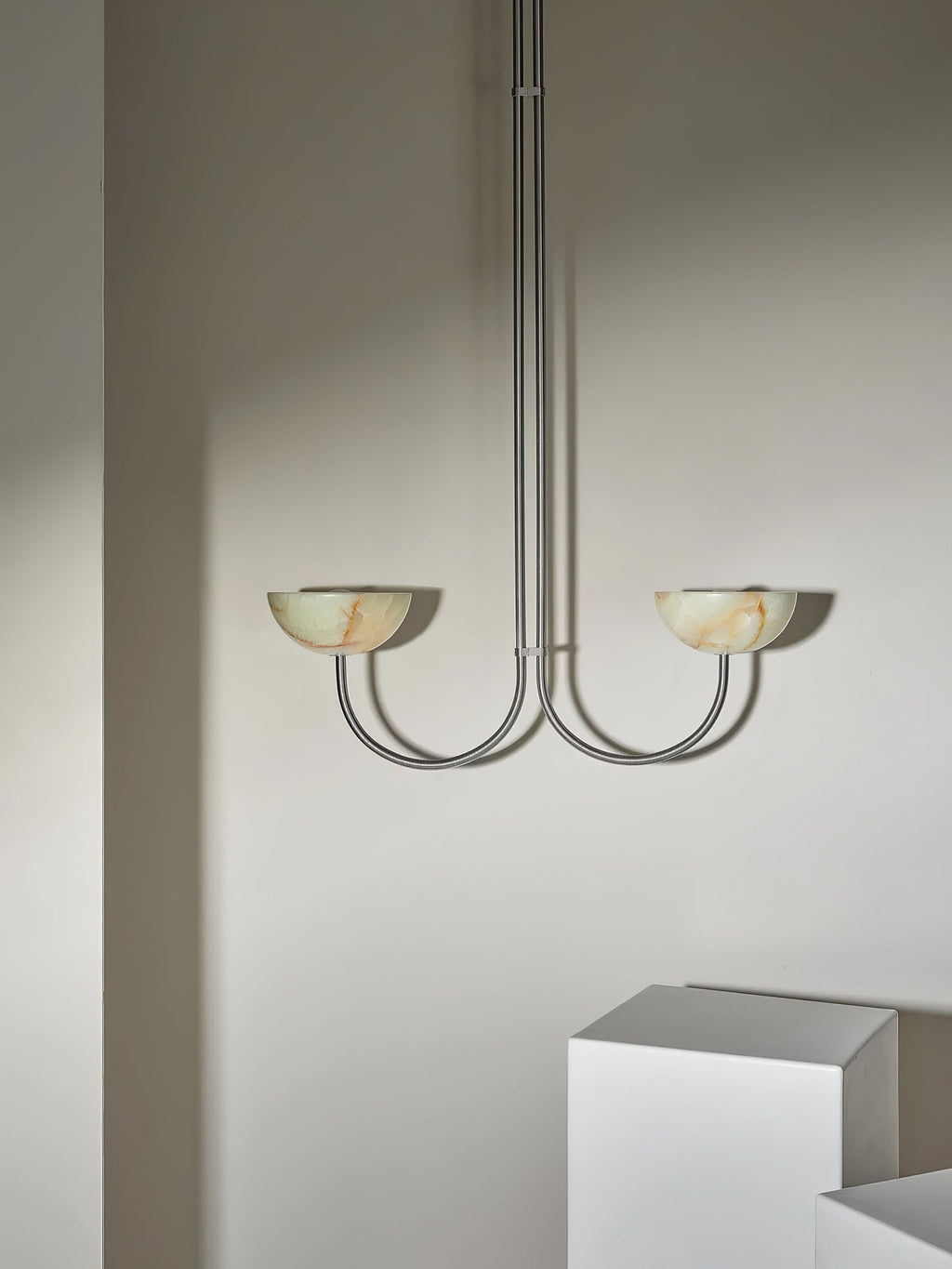 Clérachic Lunaris pendant with warm-toned alabaster bowls on slim polished arms.
