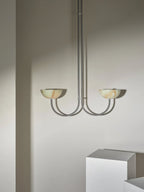Clérachic Lunaris pendant with warm-toned alabaster bowls on slim polished arms.
