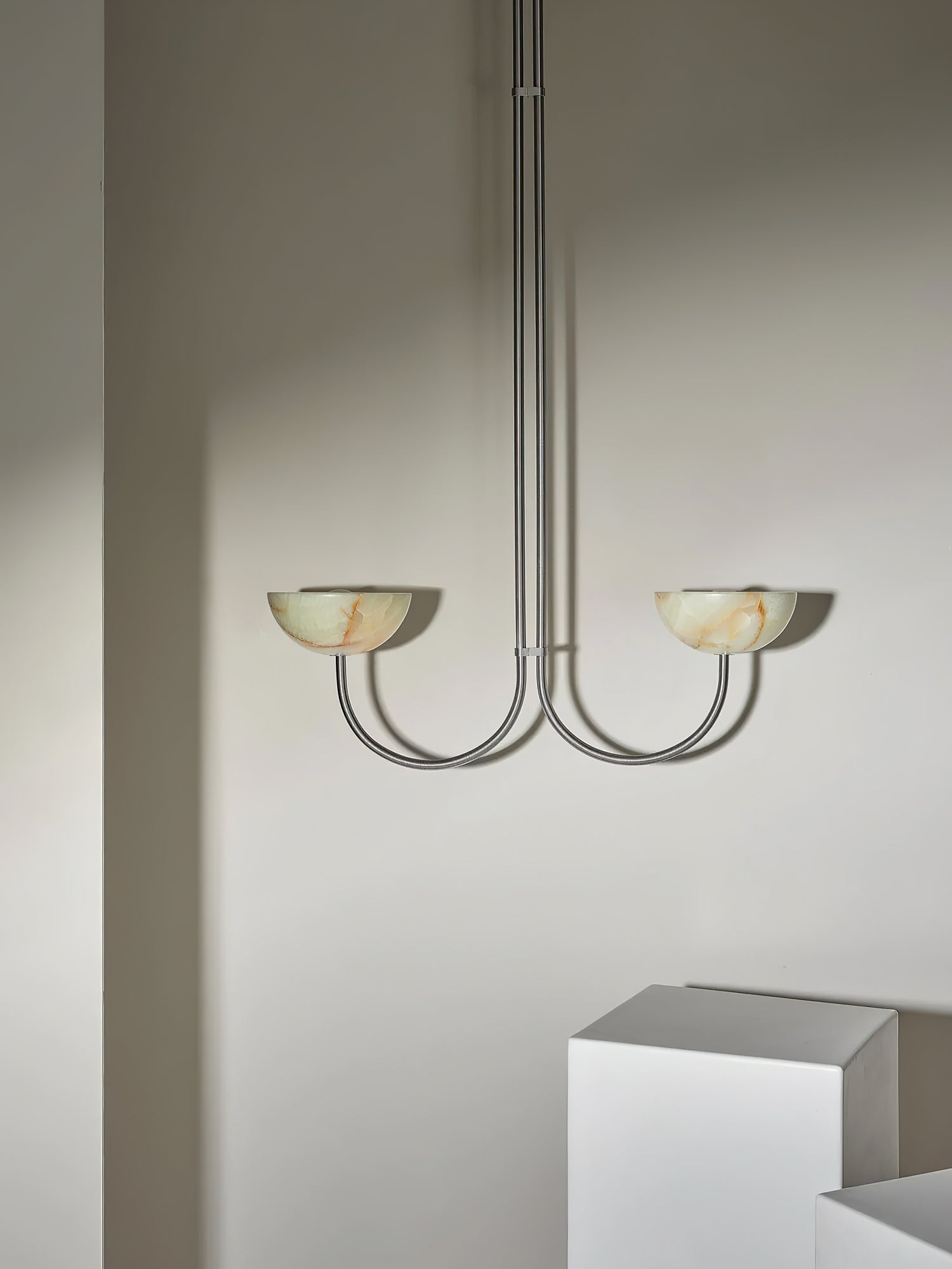 Clérachic Lunaris pendant with warm-toned alabaster bowls on slim polished arms.