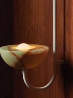 Close view of the Clérachic Lunaris bowl in nickel, rust veining running through the stone.