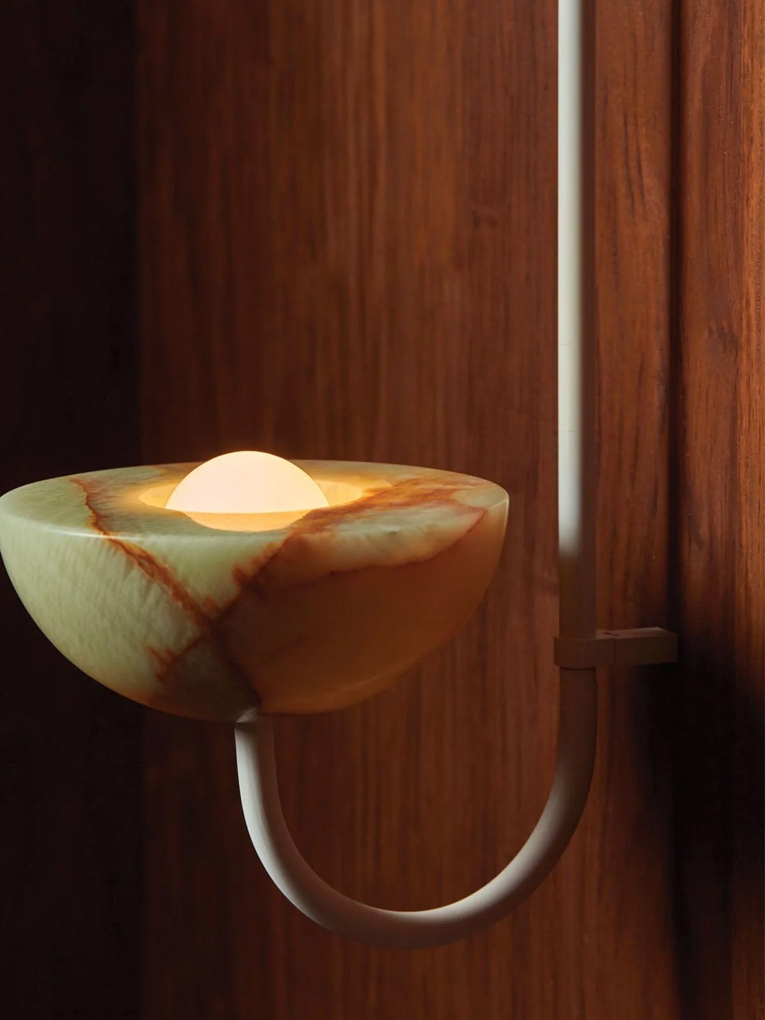 Close view of the Clérachic Lunaris bowl in nickel, rust veining running through the stone.