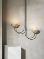 Clérachic Lunaris pendant in satin nickel, alabaster bowls tilted towards the ceiling.