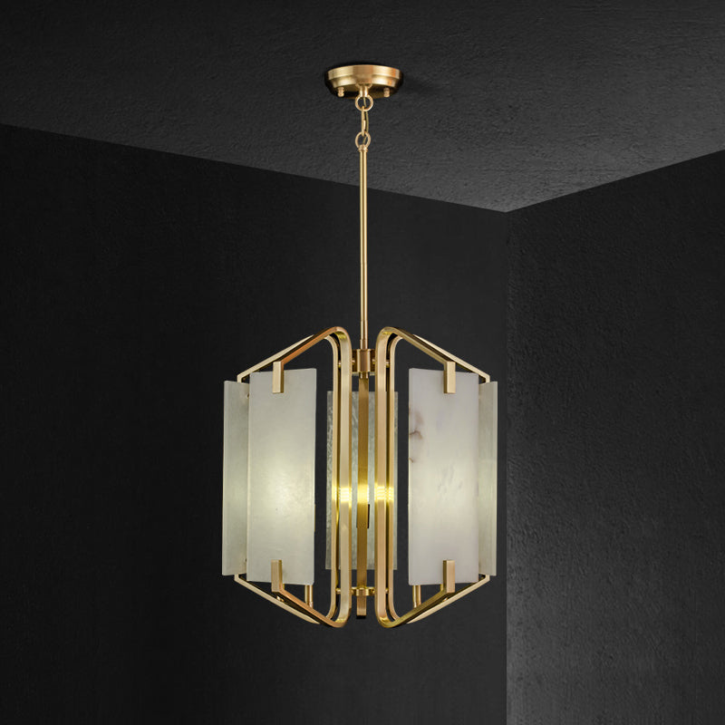Clérachic alabaster chandelier in its compact five-light form, brass cube frame set against a charcoal wall.